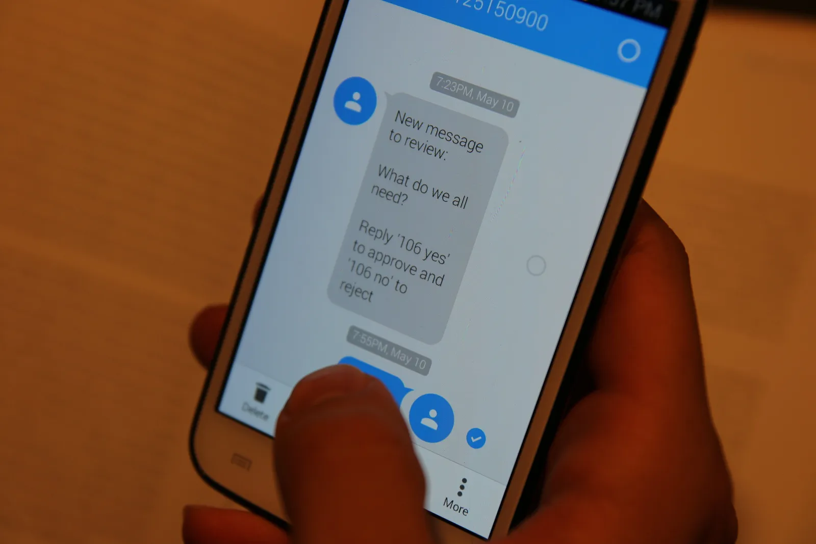 Close-up photo showing someone texting a message to the bPolite board.