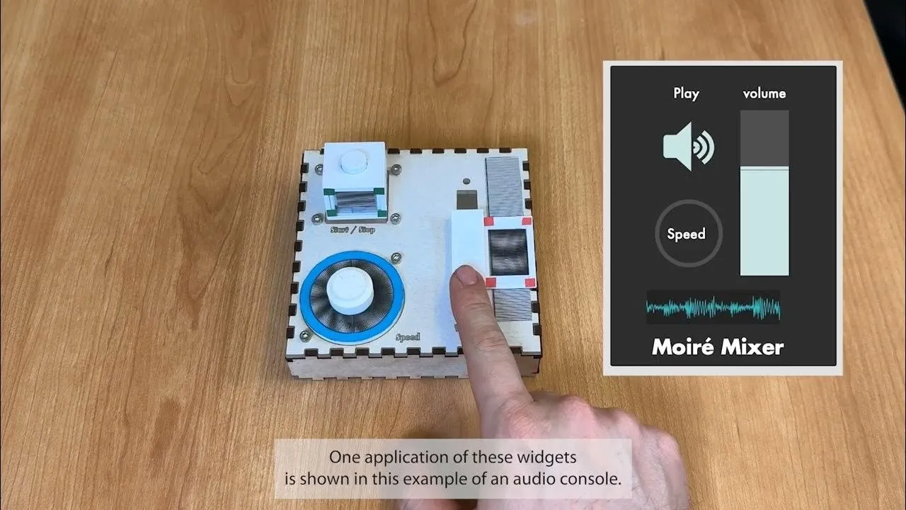 A first-person-view photo of a hand using music controller built with MoiréWidgets that has a button, diall, and slider. The hand is moving the slider as a screenshot of a music controller app on the top-right corner controls the volume.